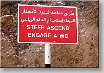 bilingual warning of steep ascend